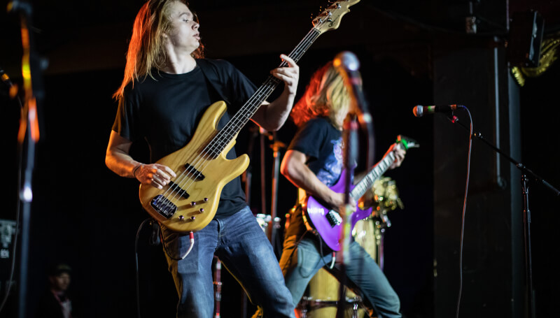 Student playing bass guitar