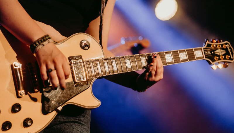 School of Rock student playing the guitar