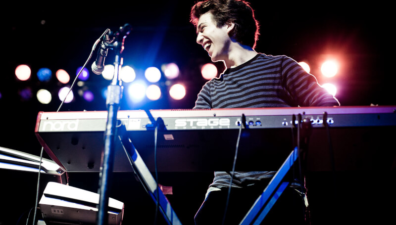 teenage boy playing the keyboard