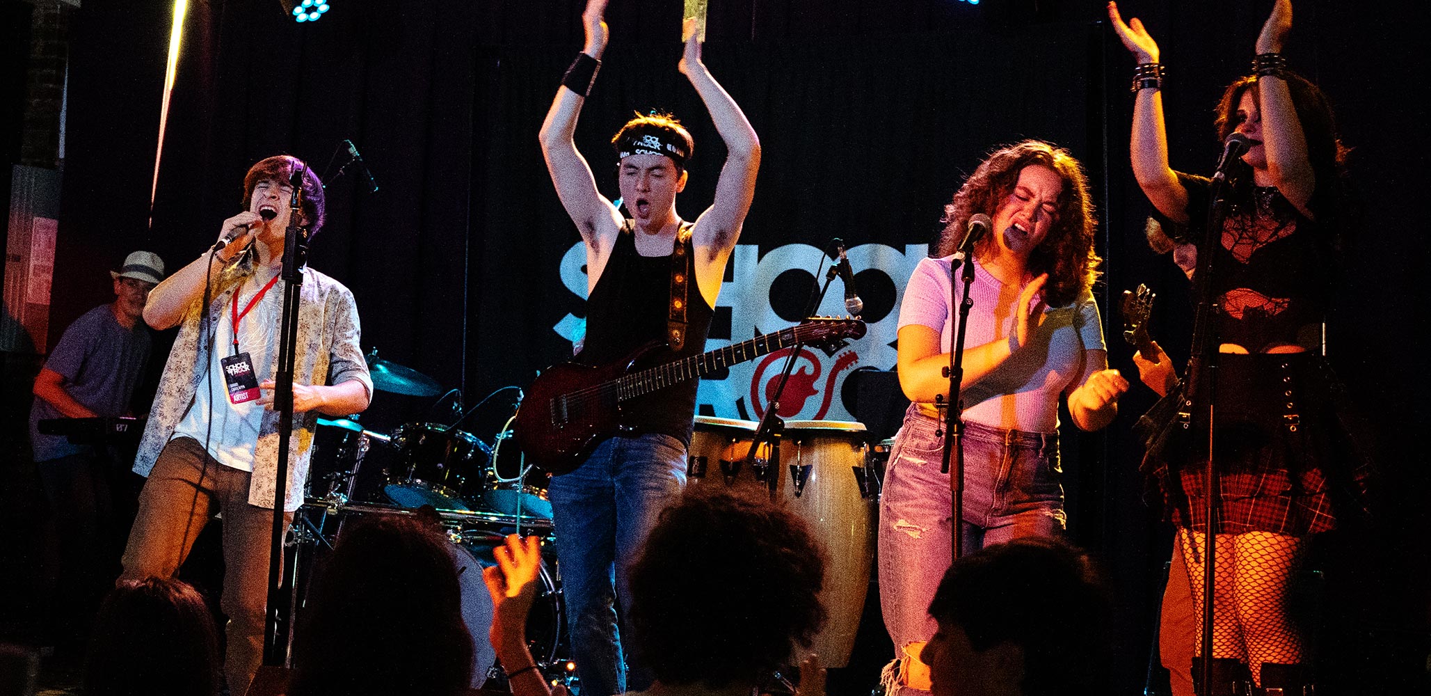 Photo of students on stage involving the audience