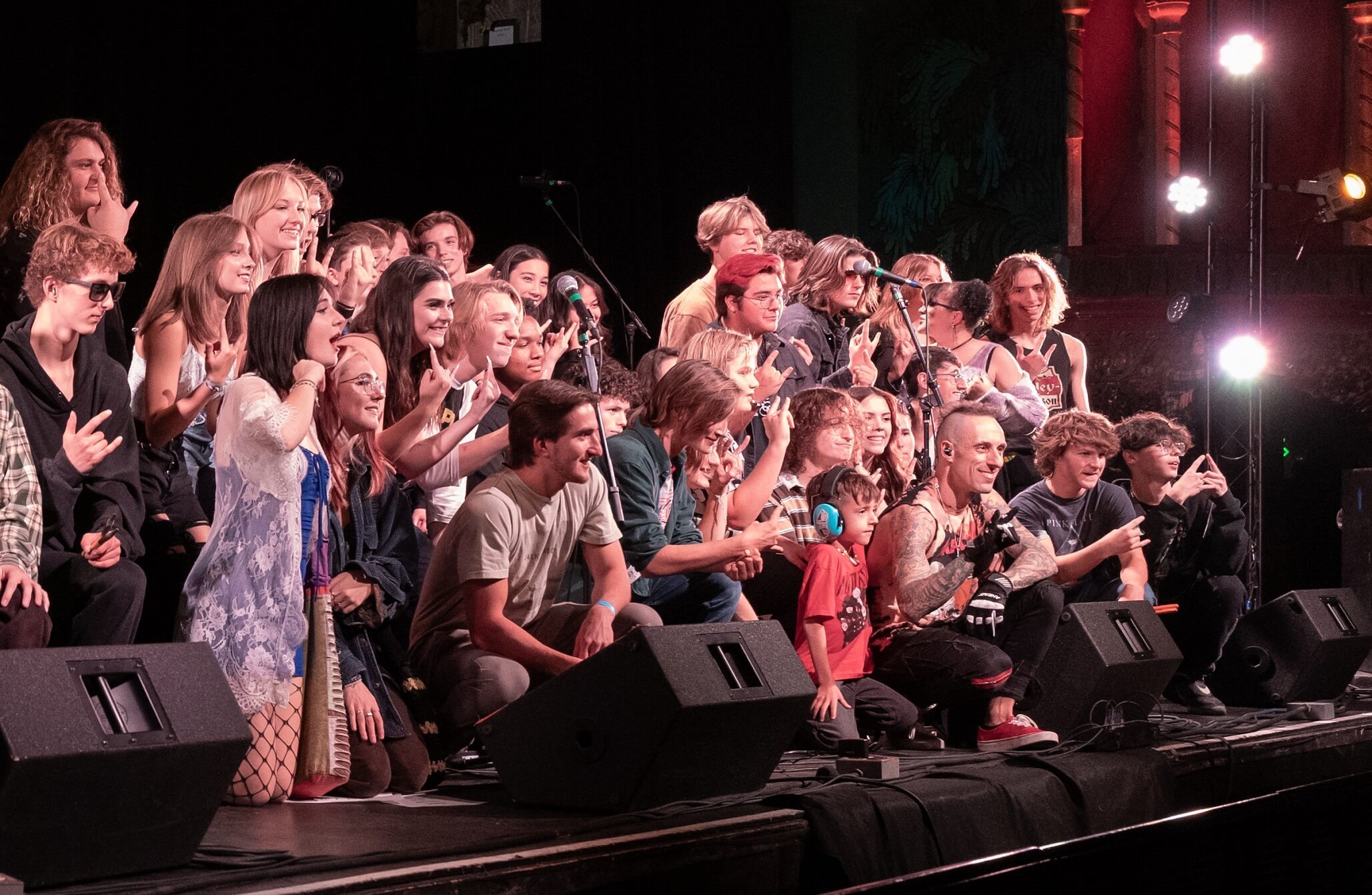 Students from six Colorado School of Rock locations take a group picture with drummer Frank Zummo