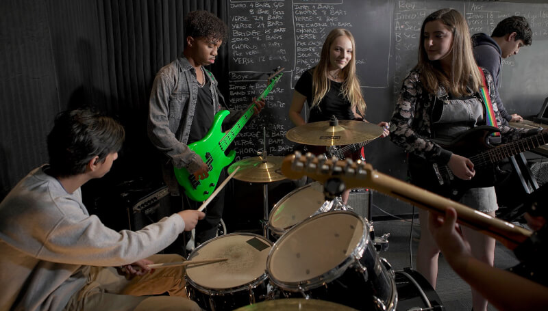 School of Rock students rehearsing