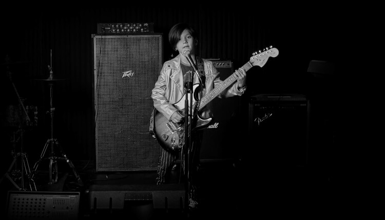 child playing guitar and singing