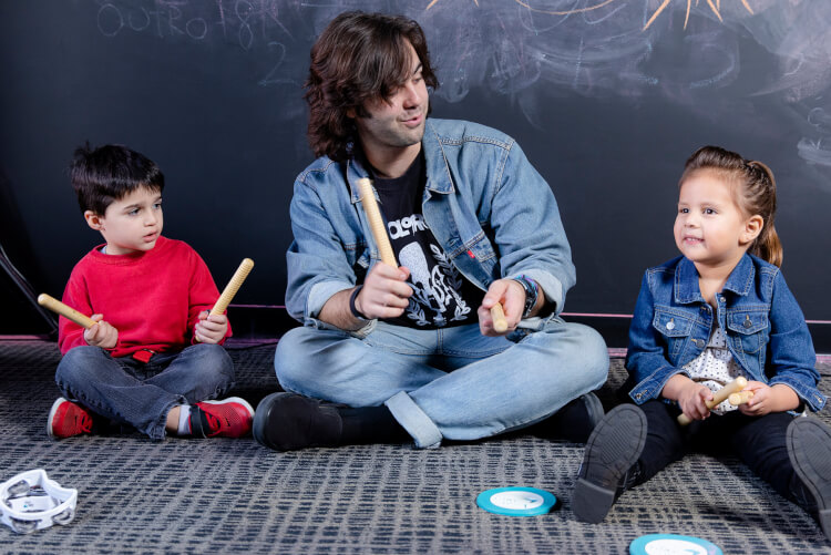 Students learning music basics with instructor